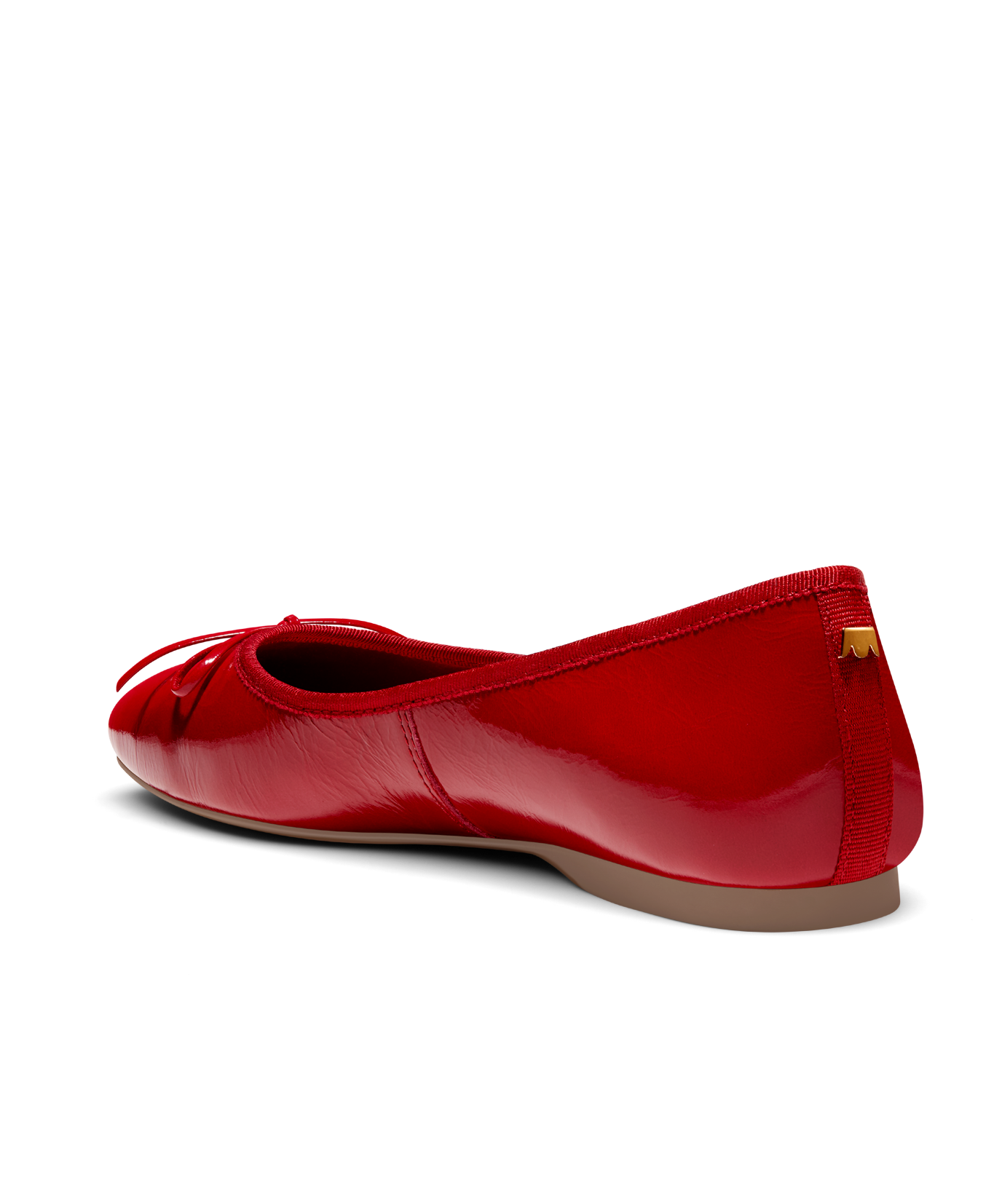 Red patent leather ballet flat with delicate bow detail, featuring a glossy finish. Back angled view.