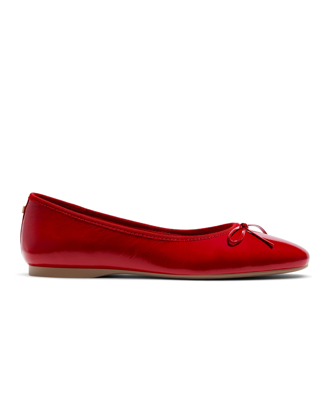 Red patent leather ballet flat with delicate bow detail, featuring a glossy finish. Side view.