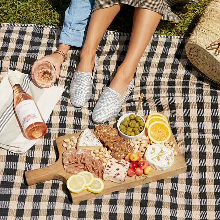 picnic with a charcuterie board and rosé wine