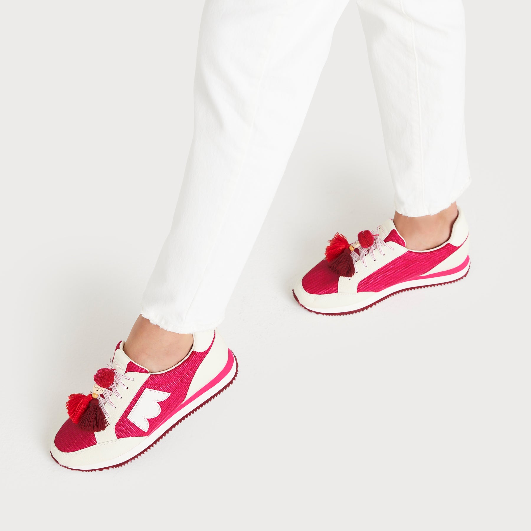 on figure top view of the Roadrunner Sneaker in Hibiscus (pink)