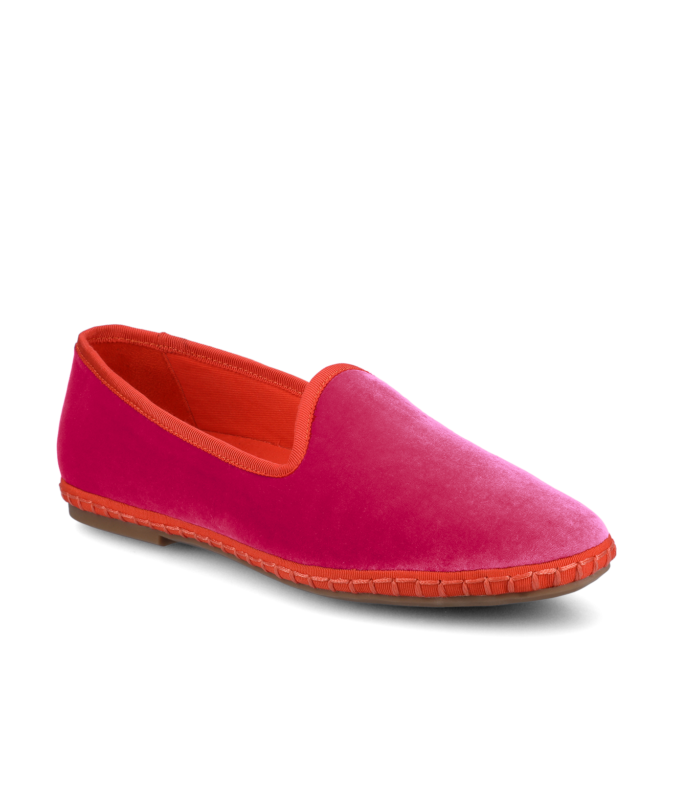 Pink slip-on shoe with orange lining on a white background