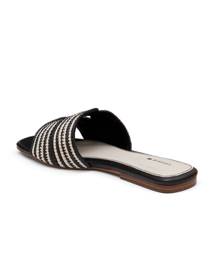 back 3/4ths view of the Kiwi sandal in Black & white Raffia