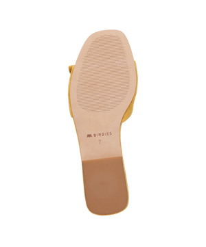 bottom view of the Kiwi Sandal in Sunflower (yellow) Suede