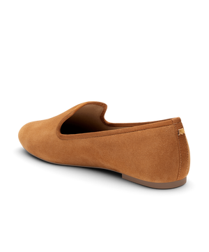 Tan suede classic loafer shoe with rounded toe, designed for comfort and style. Perfect for everyday wear. Back angled view.